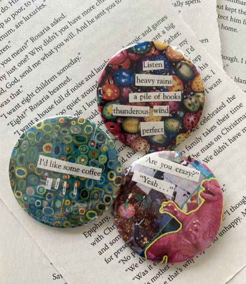 Three metal button pins with colorful background and clippings from old books