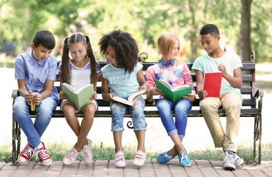 Kids reading on bench