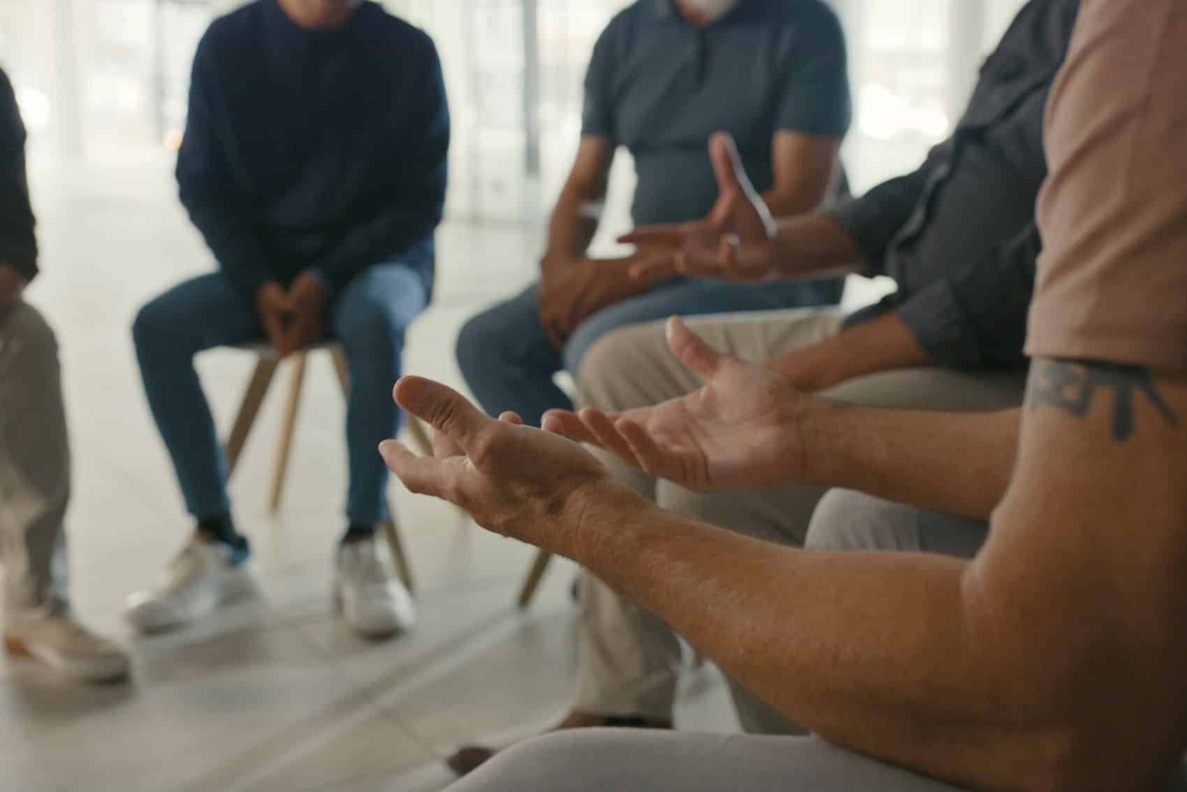 people sitting in a group discussion setting
