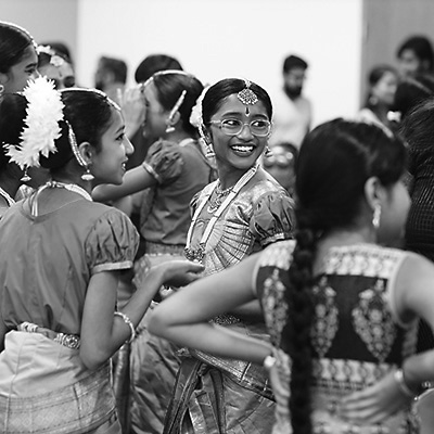 Young Diwali dance performers in a crowded Library meeting room 