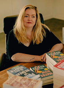 Closeup of Colleen Hoover at a book signing