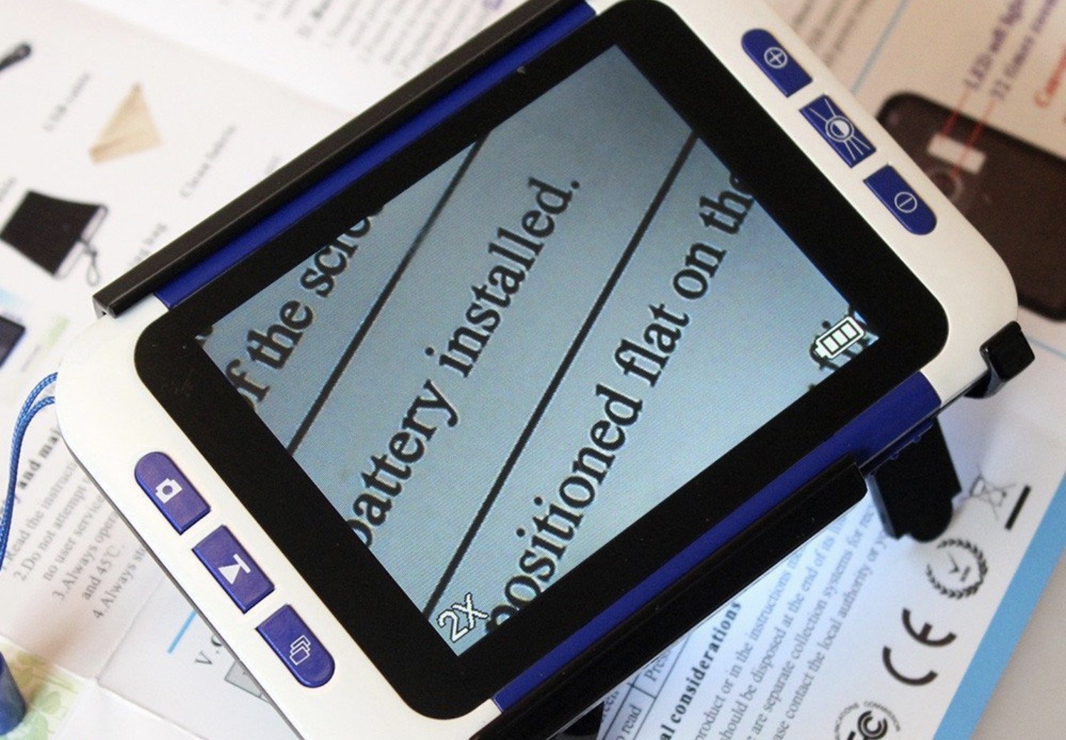 An image of an electronic magnifier showing larger text inside a book
