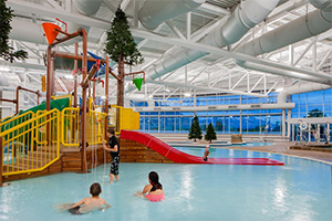 A pool in Provo City with a playground