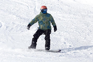 A person snowboarding down a slope