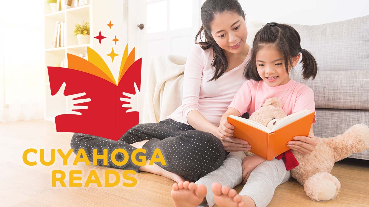 Cuyahoga Reads logo over adult and child reading together