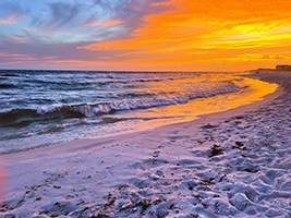 a beautiful sunset on the beach in panama city, florida