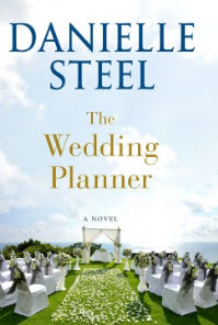 Hold a copy of The Wedding Planner
