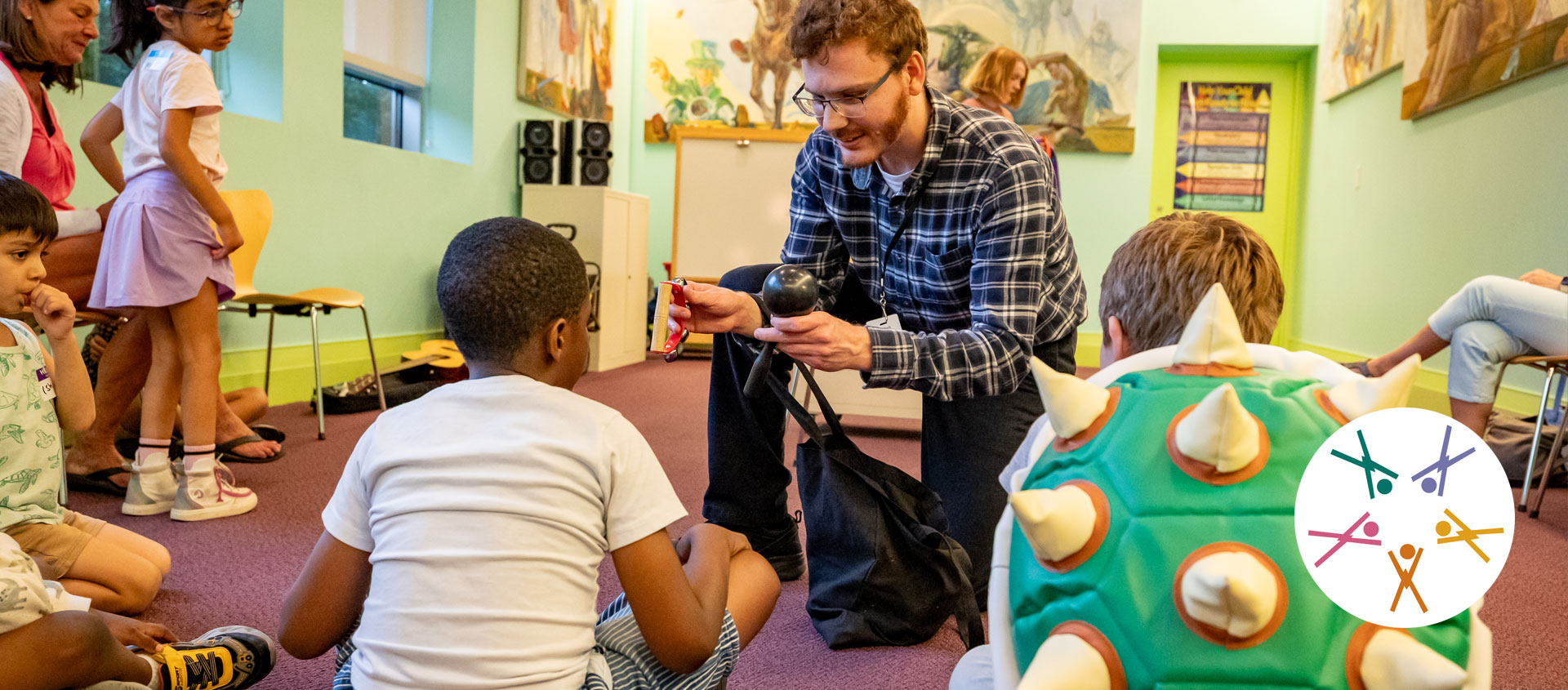 adult reads to children in a story time setting