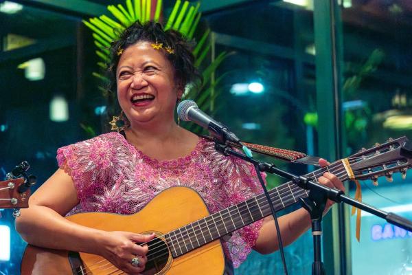 photo of Filipina singer with guitar