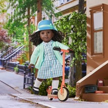 image of American Girl doll Claudie on a scooter.